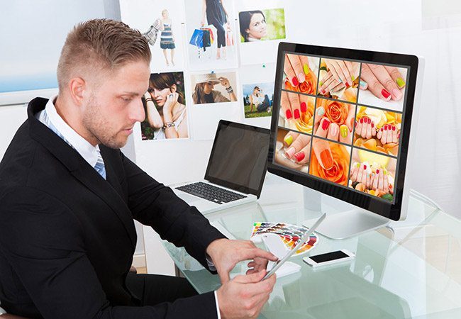 How to Avoid Poor Quality Canvas Photo Prints - Man behind computer screen