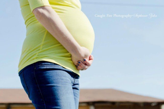 Pregnancy Photos - Holding The Belly