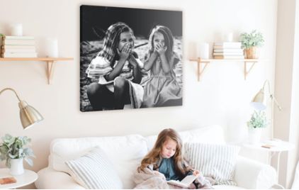 Square canvas photo print on wall with two girls in photo